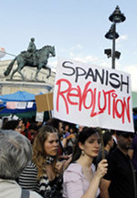 Una joven protesta con una pancarta: 