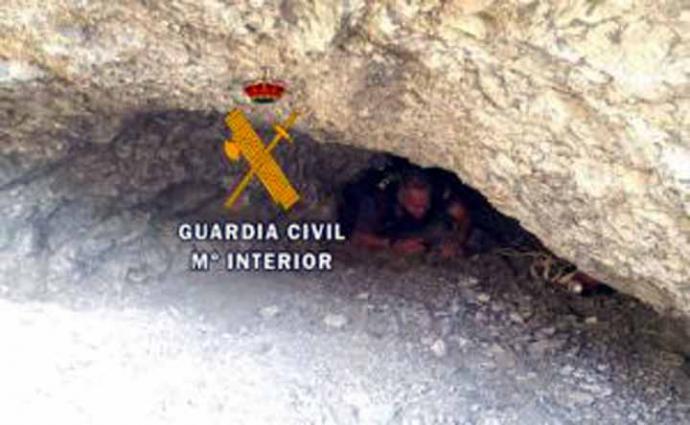 HIDDEN: Officials crawl through caves to find the missing holidaymaker