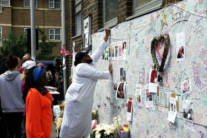 Wall of tributes to the casualties of the Grenfell Tower fire in Bramley Road, London